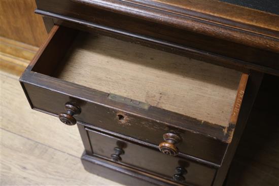 An early 20th century oak pedestal desk, W.143cm